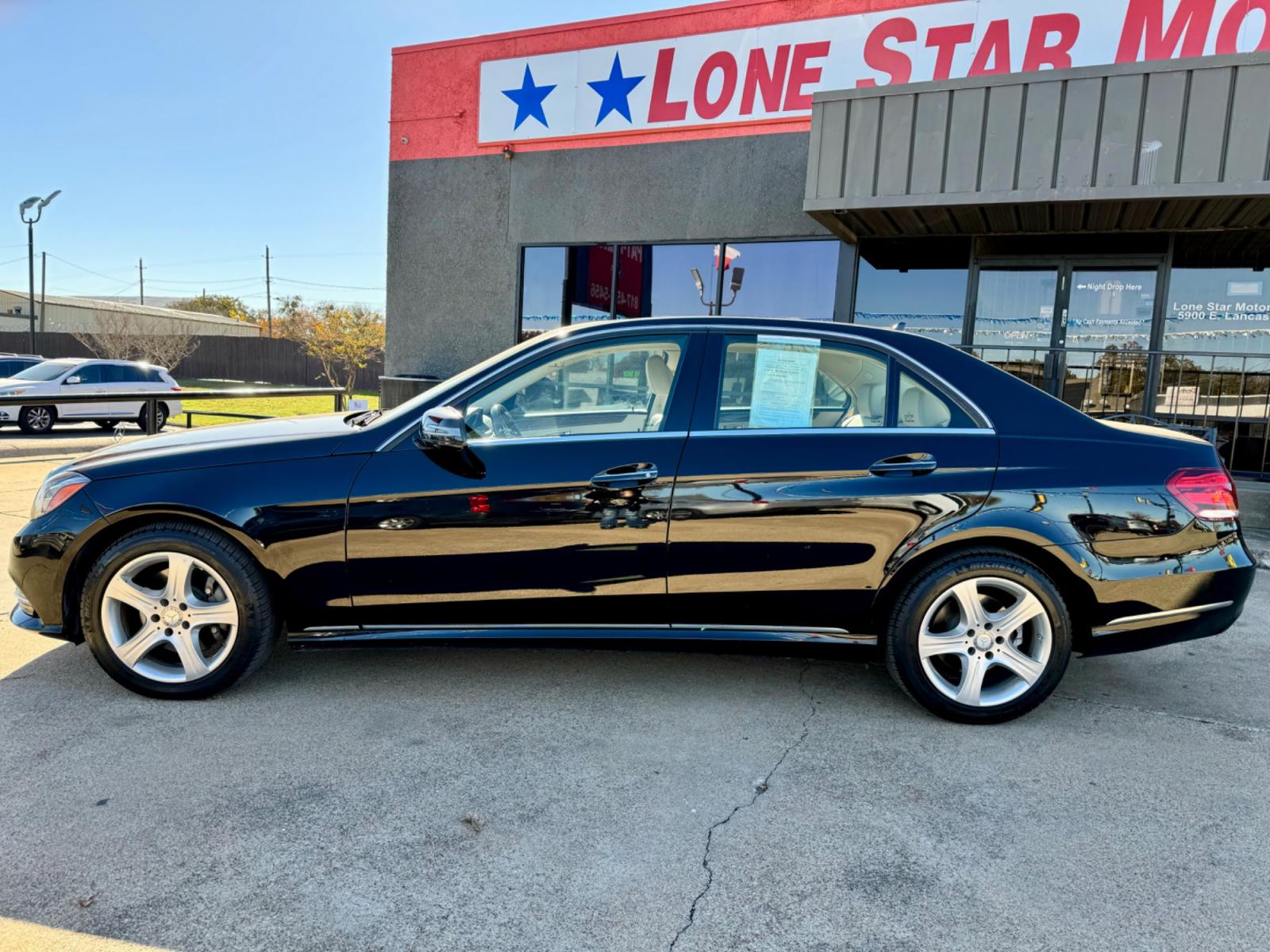 2014 BLACK MERCEDES-BENZ E-CLASS E350 (WDDHF5KB1EA) , located at 5900 E. Lancaster Ave., Fort Worth, TX, 76112, (817) 457-5456, 0.000000, 0.000000 - This is a 2014 MERCEDES-BENZ E-CLASS E350 4 DOOR SEDAN that is in excellent condition. There are no dents or scratches. The interior is clean with no rips or tears or stains. All power windows, door locks and seats. Ice cold AC for those hot Texas summer days. It is equipped with a CD player, AM/FM - Photo #2